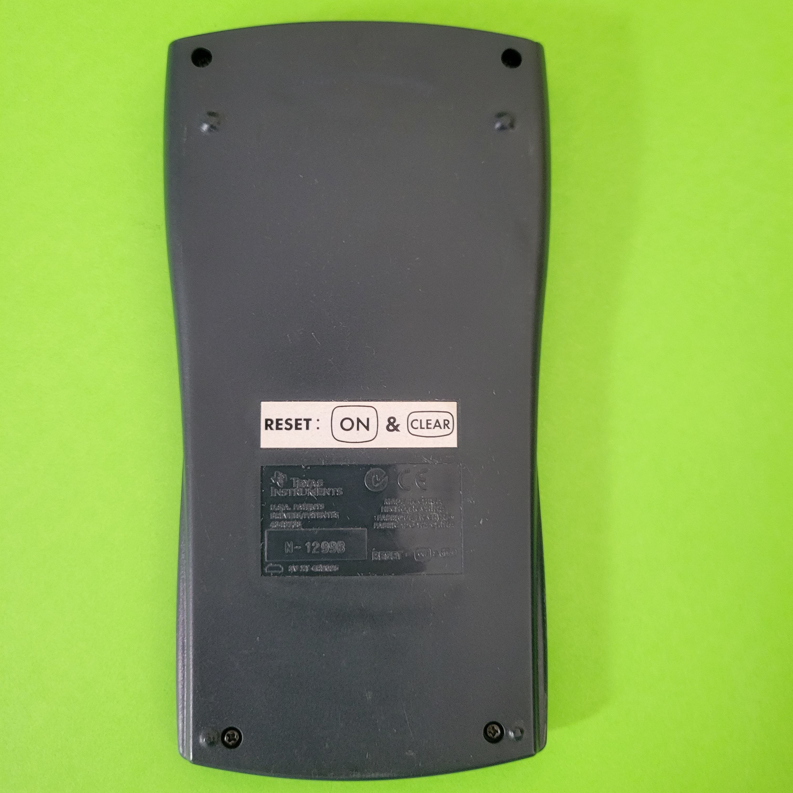 An image of the back of a texas instruments ti-30xiis scientific engineering calculator